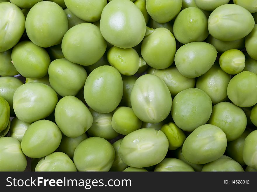 Background of fresh green peas. Close up shot.