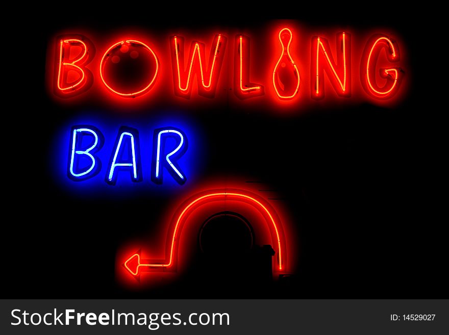 BOWLING BAR neon sign with arrow