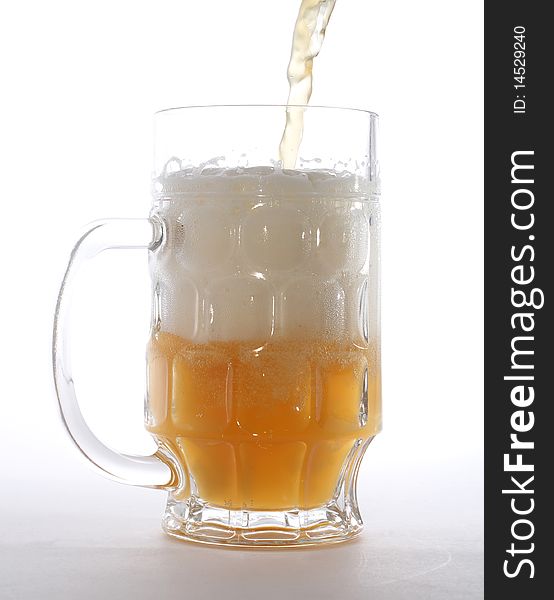 Mug with beer isolated on white