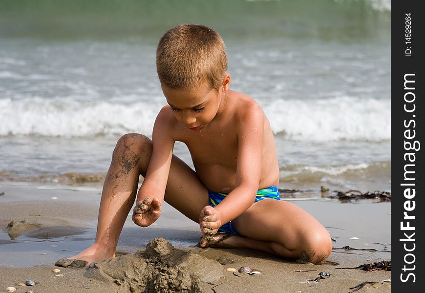 Little child playing on the beach. Little child playing on the beach