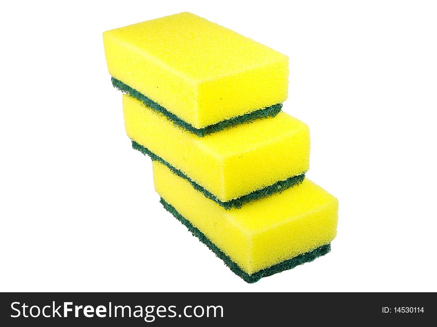 Green and yellow sponges isolated on white
