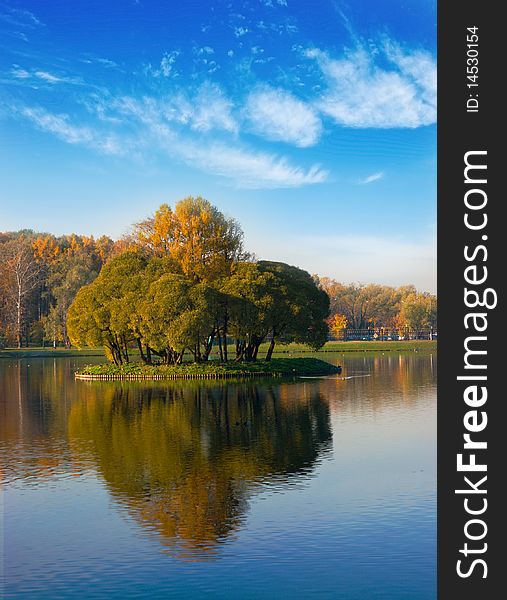 Idyllic  park area near blue lake in spring