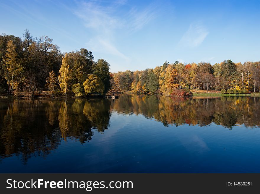 Idyllic  park area near blue lake in spring