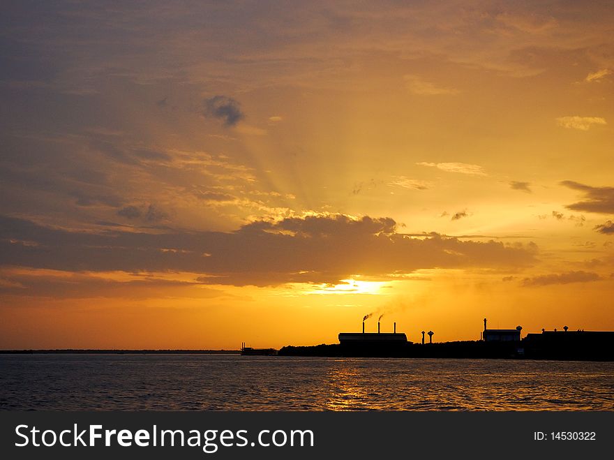 Sunset silhouette of factory