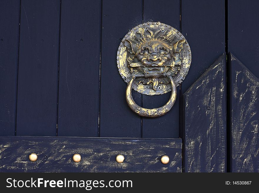 Rustic lion-head knocker