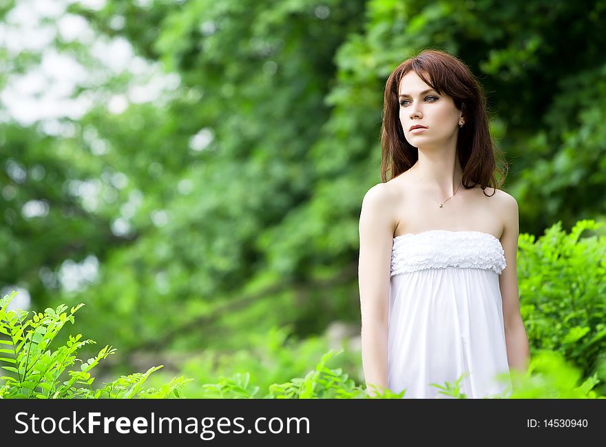 Beautiful sad girl in the park. Beautiful sad girl in the park