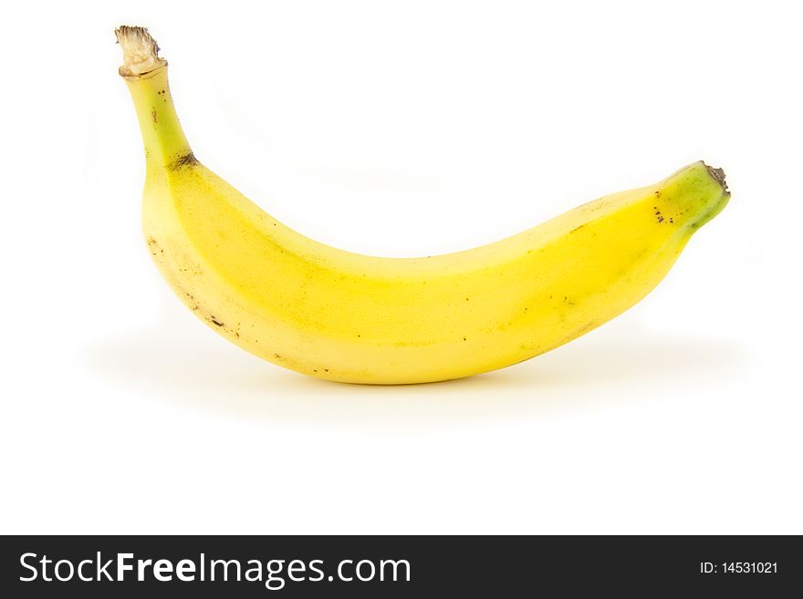 A single whole ripe fresh bright yellow banana isolated on white. A single whole ripe fresh bright yellow banana isolated on white