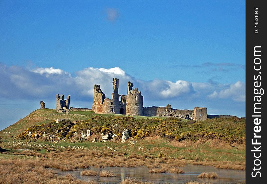 Dunstanburgh Ruined Casdtle In Northumberland England. Dunstanburgh Ruined Casdtle In Northumberland England