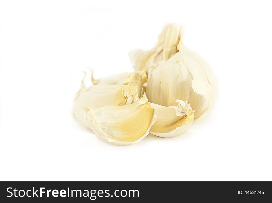 Whole unpeeled Fresh Garlic cloves isolated on a white background. Whole unpeeled Fresh Garlic cloves isolated on a white background