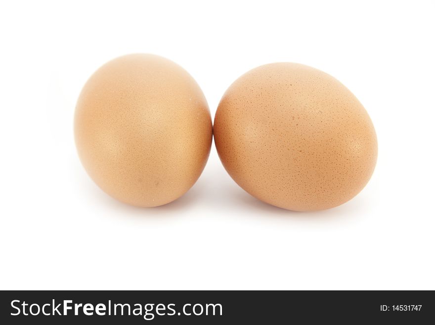 Two Organic Wholegrain Borwn Eggs isolated on a white background. Two Organic Wholegrain Borwn Eggs isolated on a white background