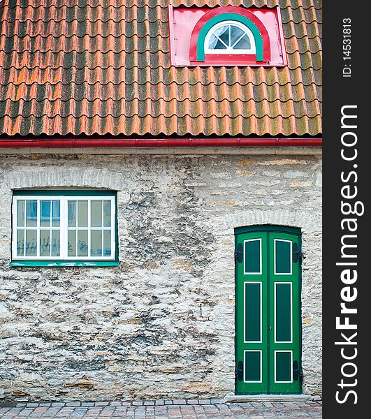 Beautiful old house with green door and windows in Tallin old town street. Beautiful old house with green door and windows in Tallin old town street