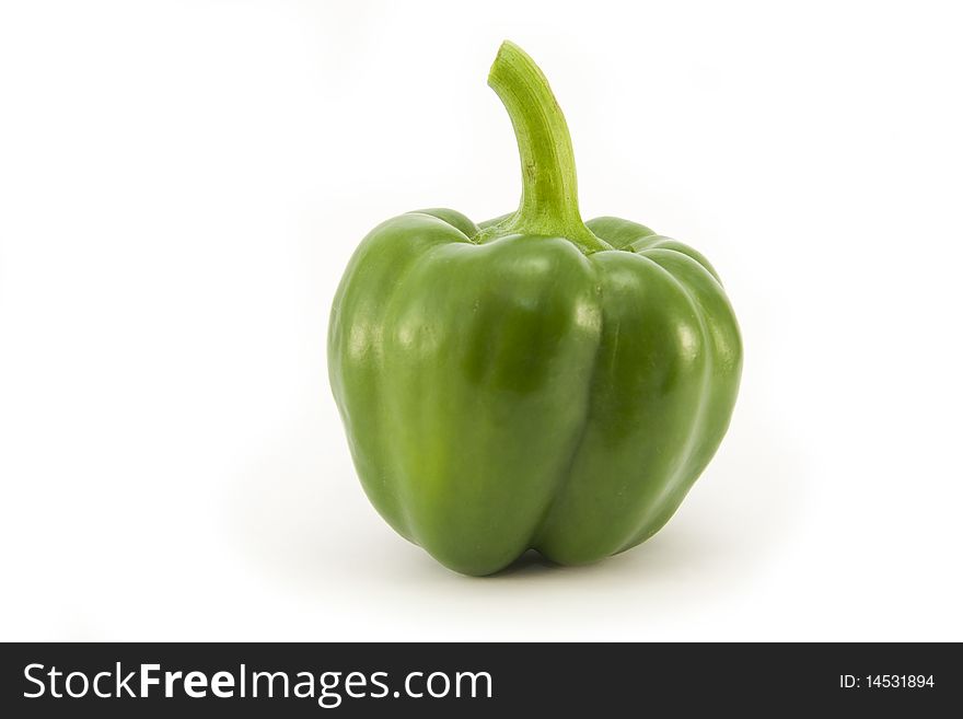 A whole fresh bright Green Pepper isolated on a white background