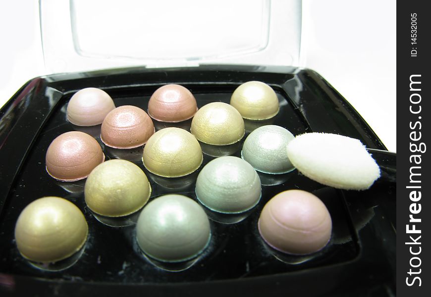 Cosmetic pearl eye shadows closeup. Cosmetic pearl eye shadows closeup