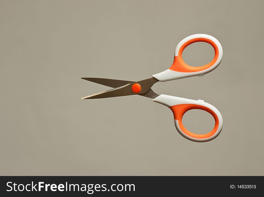 Isolated scissors on grey background