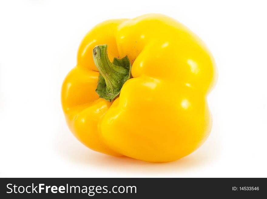 Whole sweet yellow bell pepper isolated on a white background