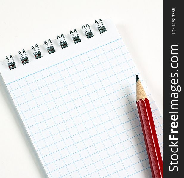 Blank notepad with graphitic pencil