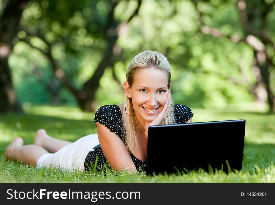 Girl with notebook in park