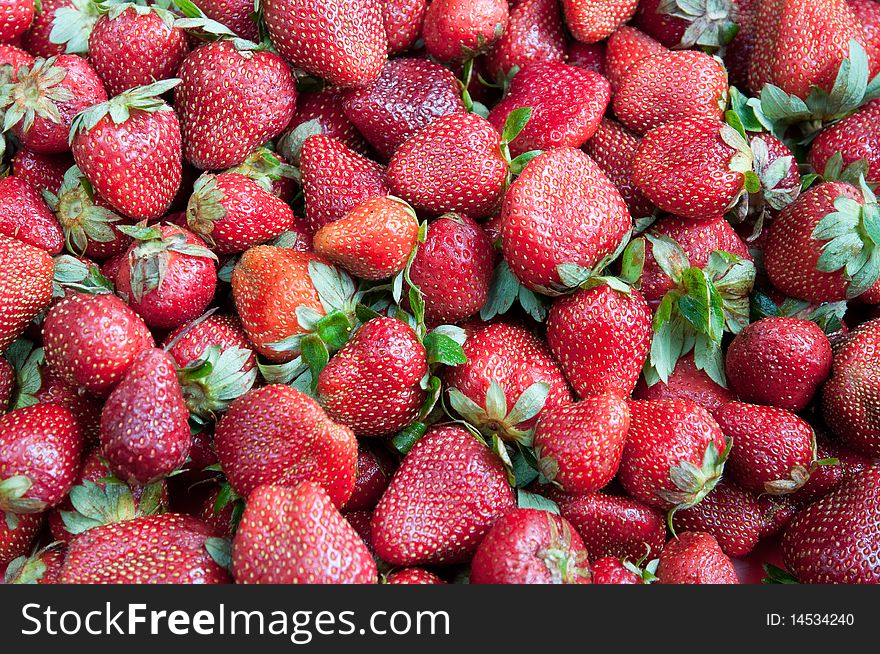 Red juicy strawberries background, horizontal