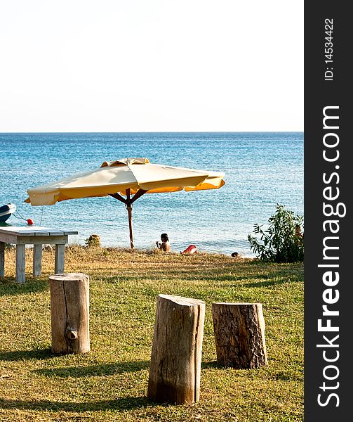 Stools and umbrella on the beach