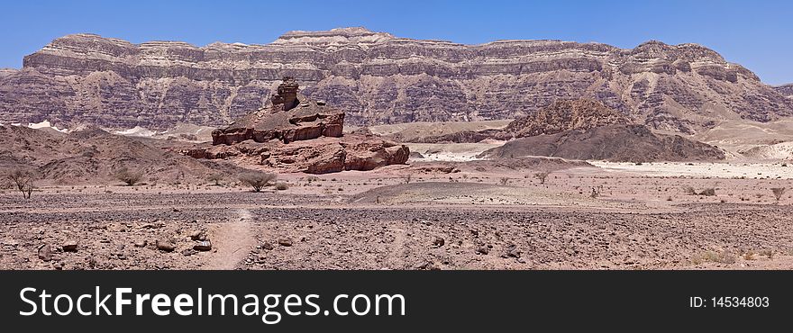 The spiral hill located in Timna Park. The park is located approximately 25 kilometers north of Eilat, in the middle of the Red Sea Desert. The spiral hill located in Timna Park. The park is located approximately 25 kilometers north of Eilat, in the middle of the Red Sea Desert.