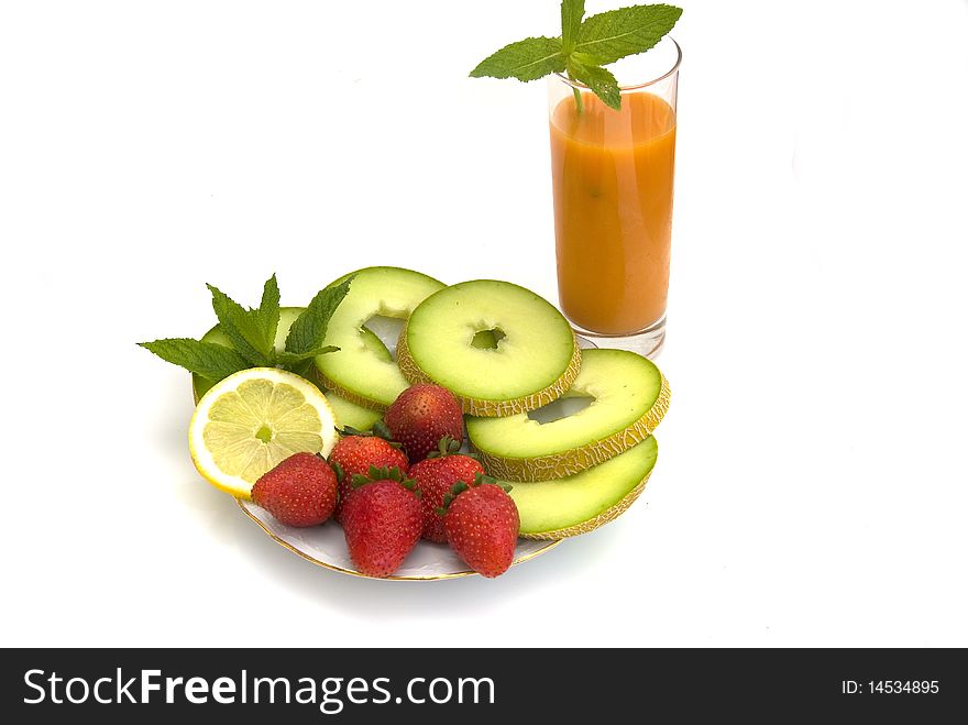 The strawberry, melon  and juise isolated on a white background. The strawberry, melon  and juise isolated on a white background