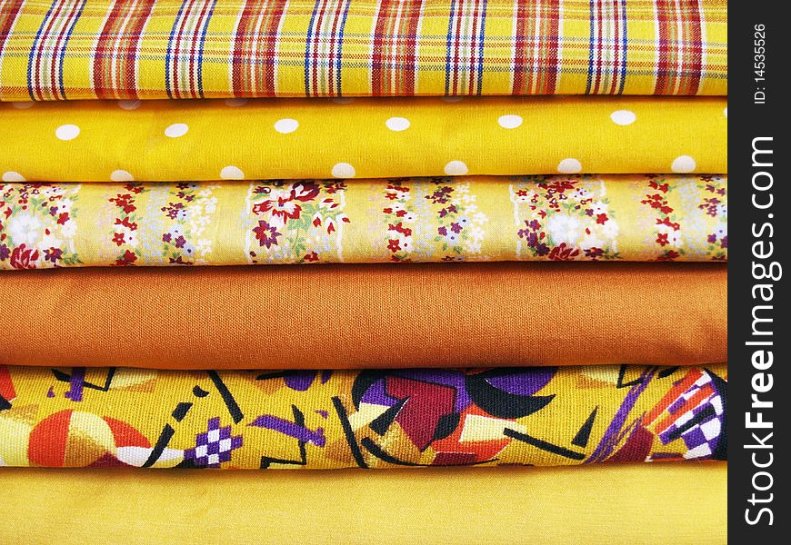 Yellow cotton with different prints for sewing and patchwork. Yellow cotton with different prints for sewing and patchwork