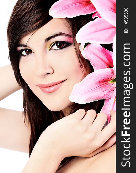 Shot of a young beautiful woman with a lily flowers. Isolated over white background. Shot of a young beautiful woman with a lily flowers. Isolated over white background.