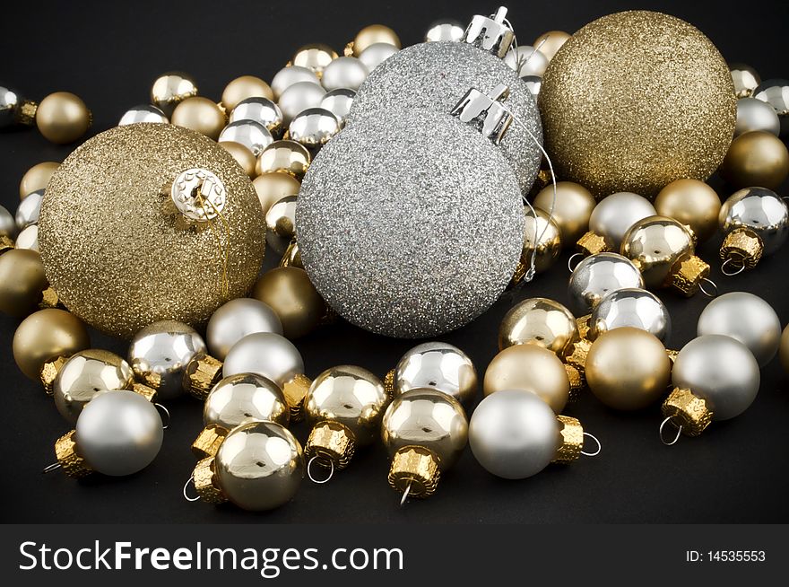 Full pack of silver and golden christmas balls on black. Full pack of silver and golden christmas balls on black