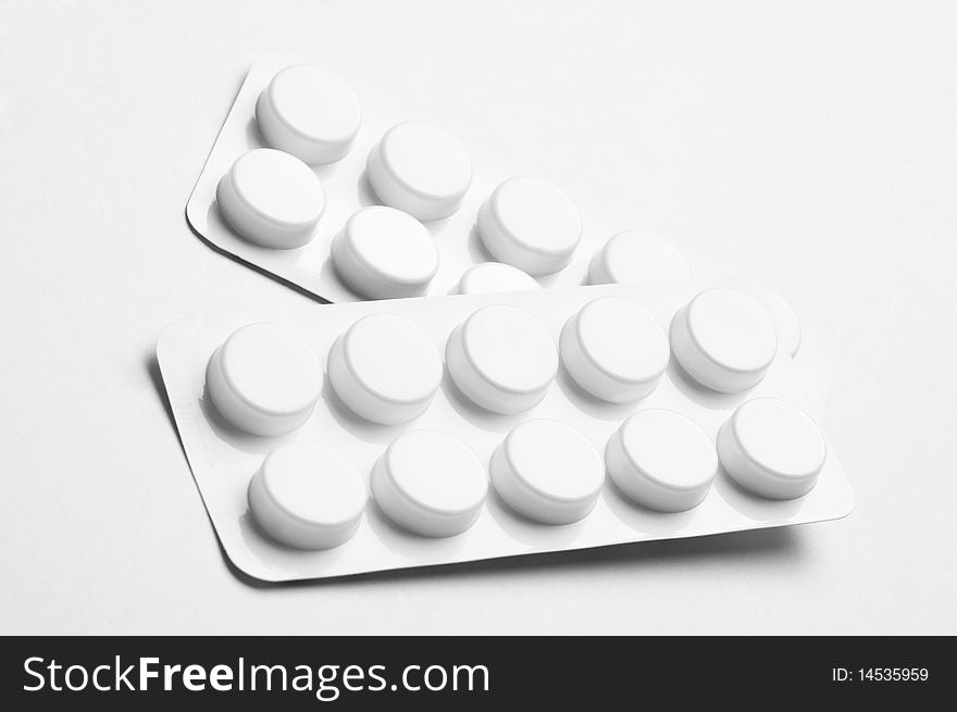 Macro of pills isolated on white background