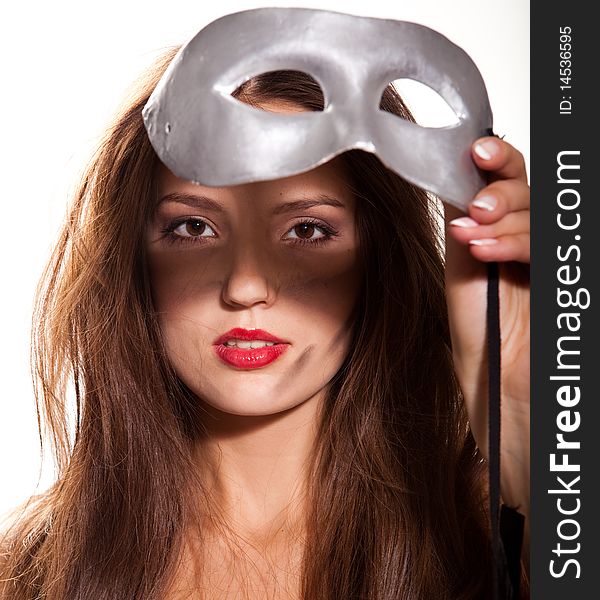 Young beautiful woman with silver mask in her hand. Young beautiful woman with silver mask in her hand