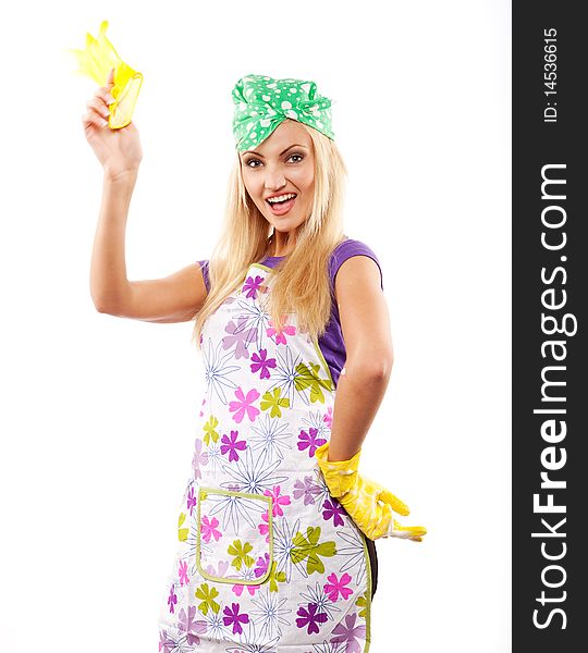 Young beautiful housewife in yellow rubber gloves