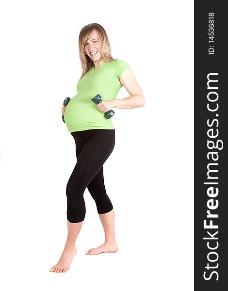 A woman that is pregnant is working out with weights. A woman that is pregnant is working out with weights.