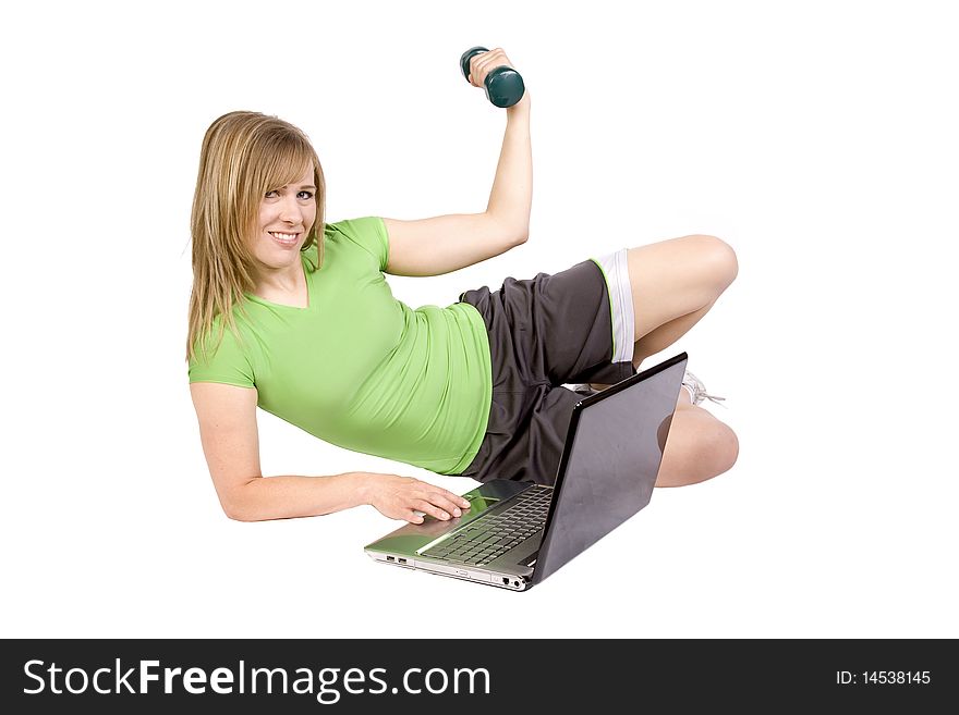 A woman with a laptop computer and wearing an exercise outfit. A woman with a laptop computer and wearing an exercise outfit.