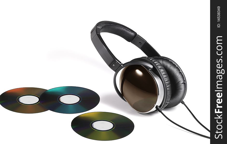 Image of head phones and multi color DVD. Image of head phones and multi color DVD