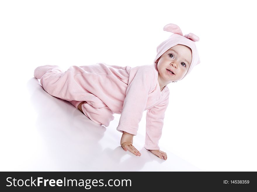 Baby wearing bunny suit isolated on white