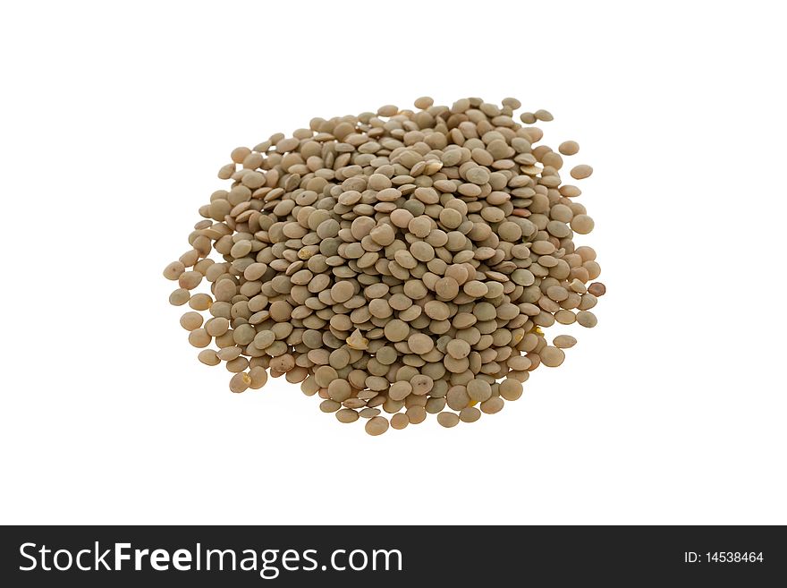 Brown lentils isolated on a white background. Brown lentils isolated on a white background