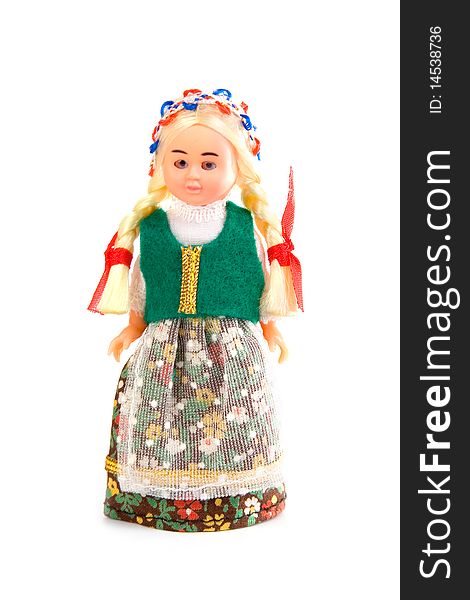 Doll in the Polish national costume on a white background