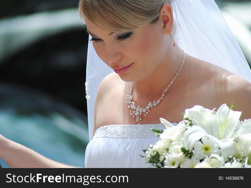 The young woman the bride with a bouquet color