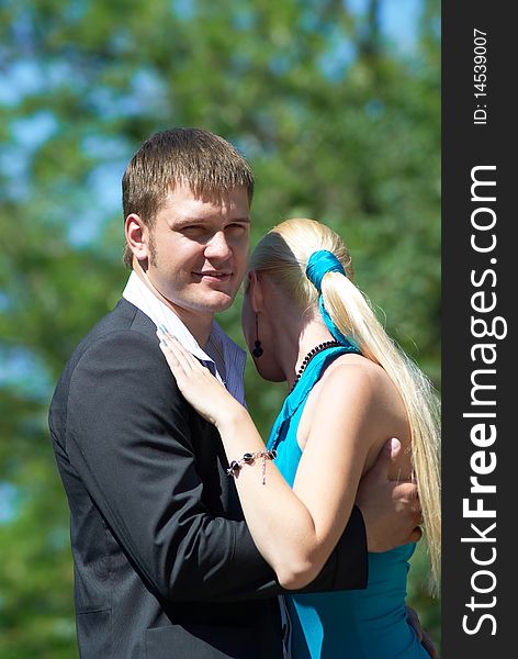 Portrait of a happy young couple in park