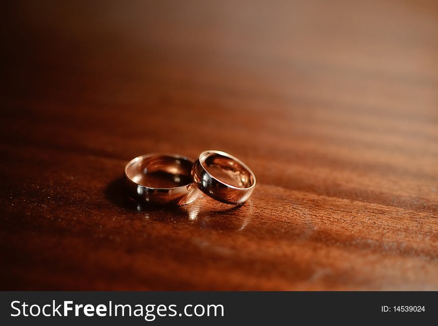 Beautiful background with two gold wedding rings