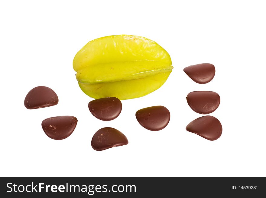 Star fruit with chocolate petals on white background