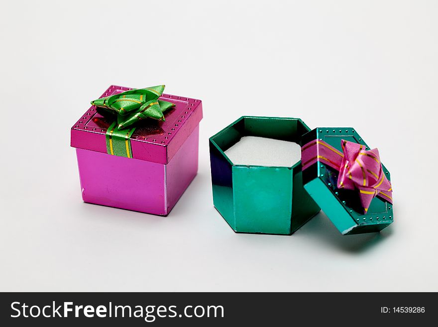 A small pink and open green box for a small gift. A small pink and open green box for a small gift.