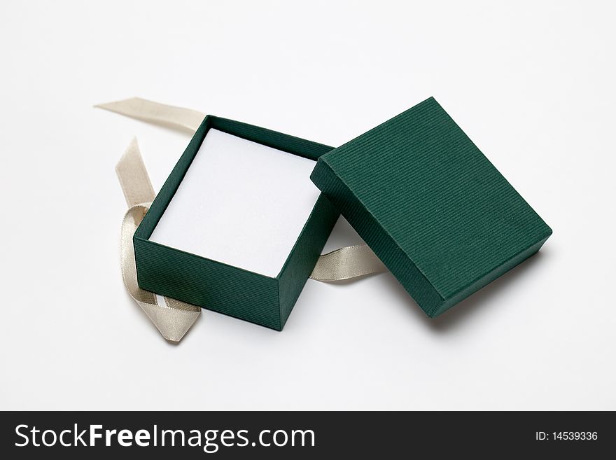 A small green gift box that is open. A small green gift box that is open.