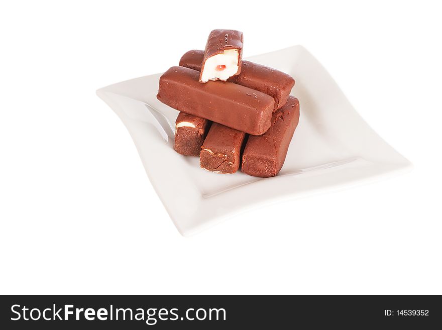 Chocolate curd cakes on plate, isolated on white