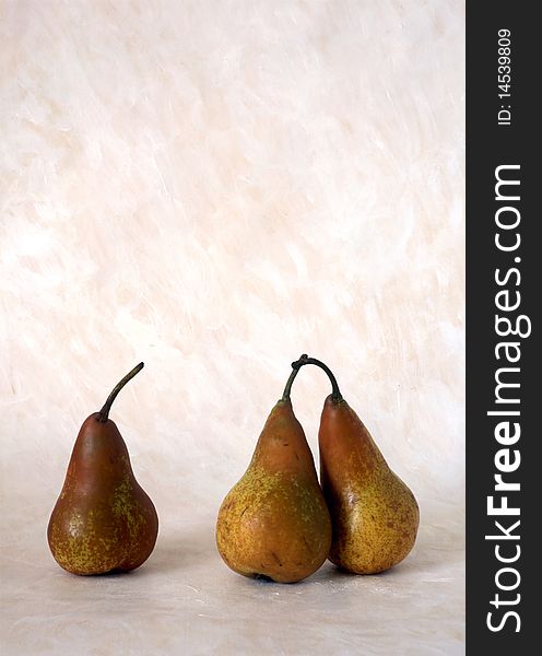 Three red pears isolated on painted background