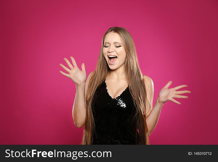 Portrait of emotional woman on colorful background