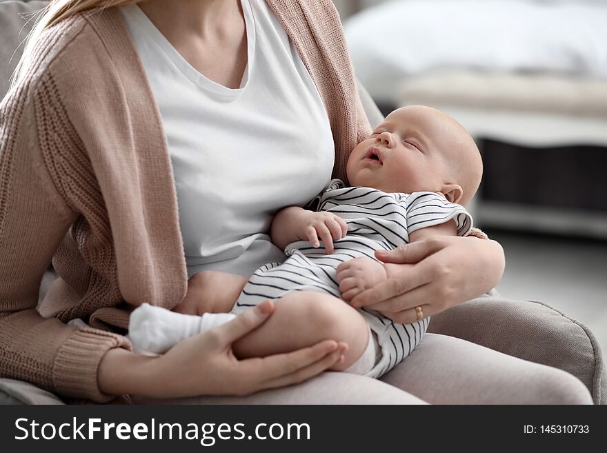 Mother with her little baby at home