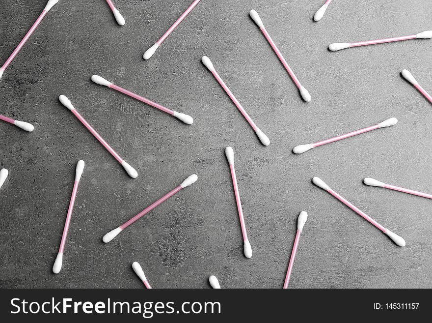 Flat lay composition with cotton swabs on grey background