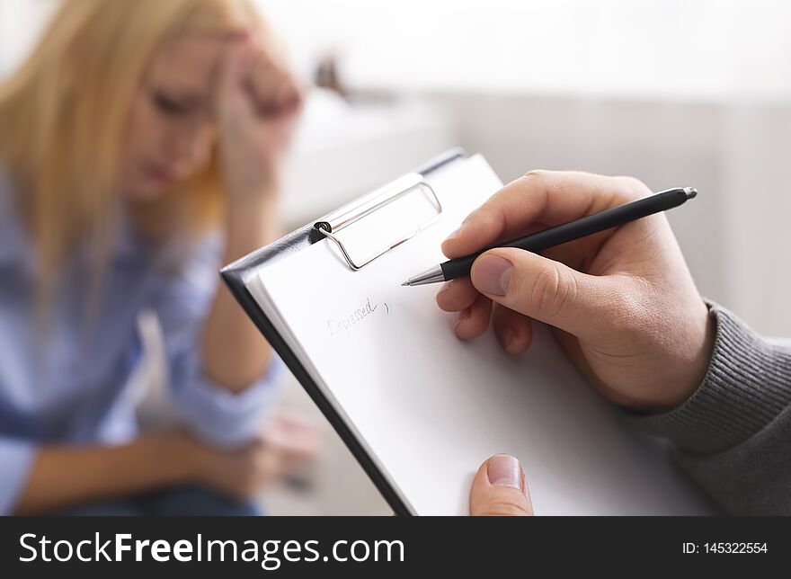 Psychological diagnosis. Professional skillful psychologist taking notes, listening to her patient, empty space. Psychological diagnosis. Professional skillful psychologist taking notes, listening to her patient, empty space