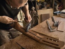 The Guitar Master Makes Guitar Neck. Royalty Free Stock Image